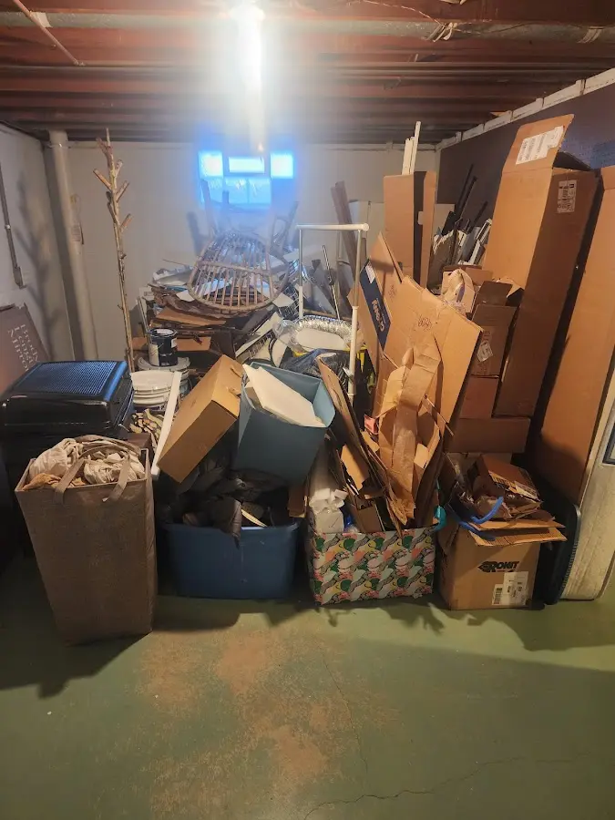 Roll-off dumpster container at job site for 2 Yard Dumpster Rental in Huron